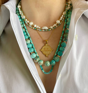 stack of turquoise gemstone and freshwater pearl necklace, empowering, cleansing and calm  qualities.