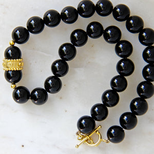 black onyx and gold vermeil necklace with empowering qualities.