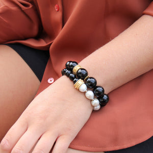 black onyx and freshwater pearl bracelets with gold vermeil imparting empowering qualities